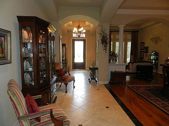 Another View of the Foyer showing High Ceilings & Archways.