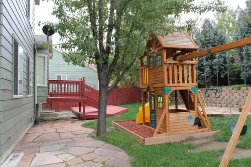 Backyard with playset and patio - 1567 Daily Dr