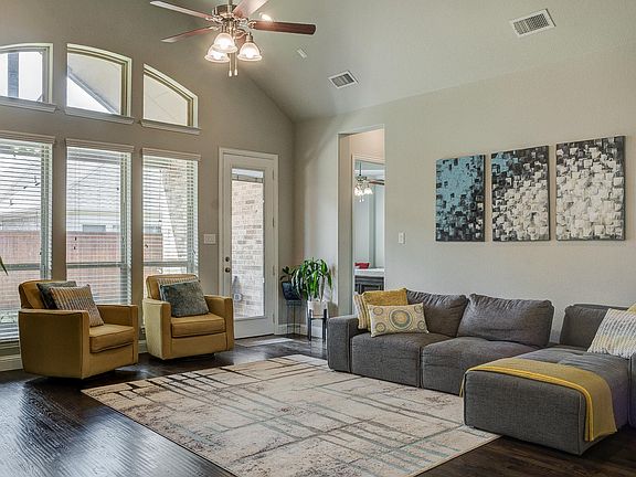 Spacious living room with cathedral ceiling and wired for surround speakers