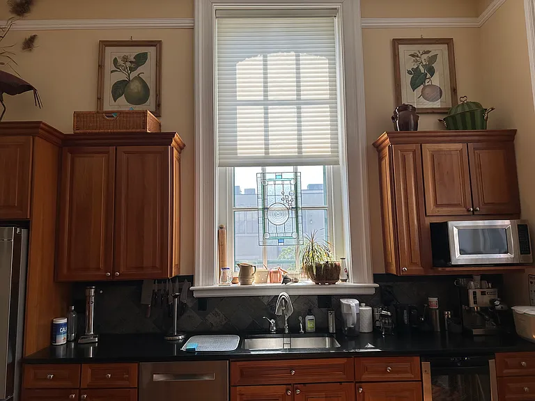 Kitchen storage. Bosch dishwasher and refrigerator, wine cooler, and microwave.