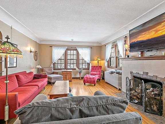 Living room with wood burning fireplace - and awesome views to the creek and trails!