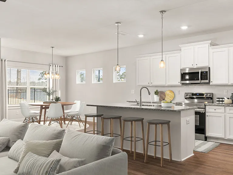A view of the spacious kitchen and stainless steel appliances