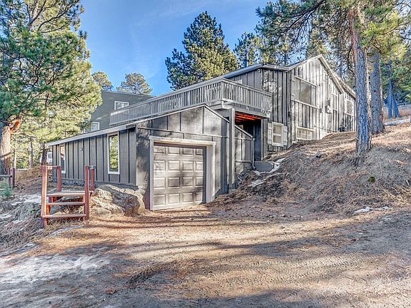 Oversized one car detached garage with lots of storage.