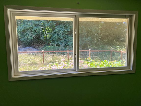 View to the west into the fenced in part of the yard