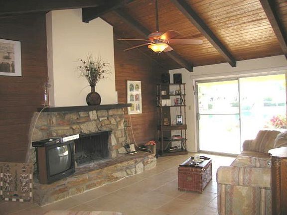 Family room with firelplace opens to lake