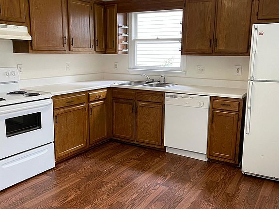 Fresh kitchen with crisp counters and flooring!