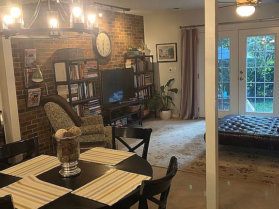 Open floor plan w/brick wall