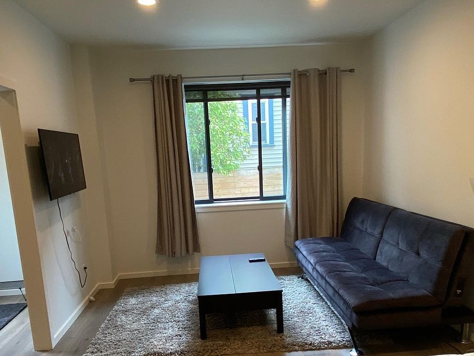 Living room with sofa, TV and table