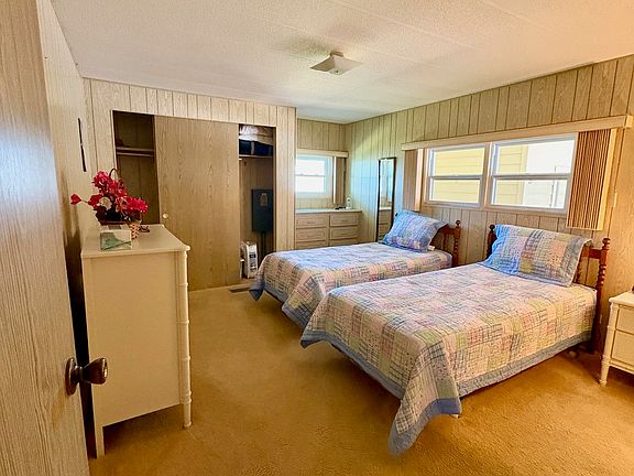 Primary bedroom with two twin beds. Second bedroom has a queen bed; if you prefer, they can be swapped