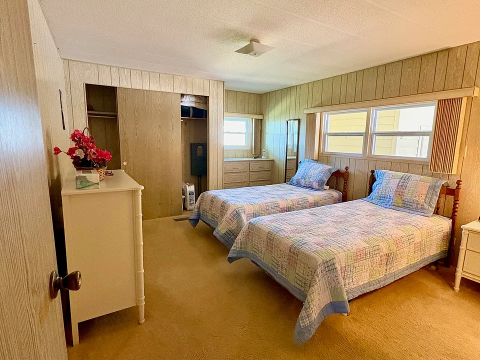 Primary bedroom with two twin beds. Second bedroom has a queen bed; if you prefer, they can be swapped