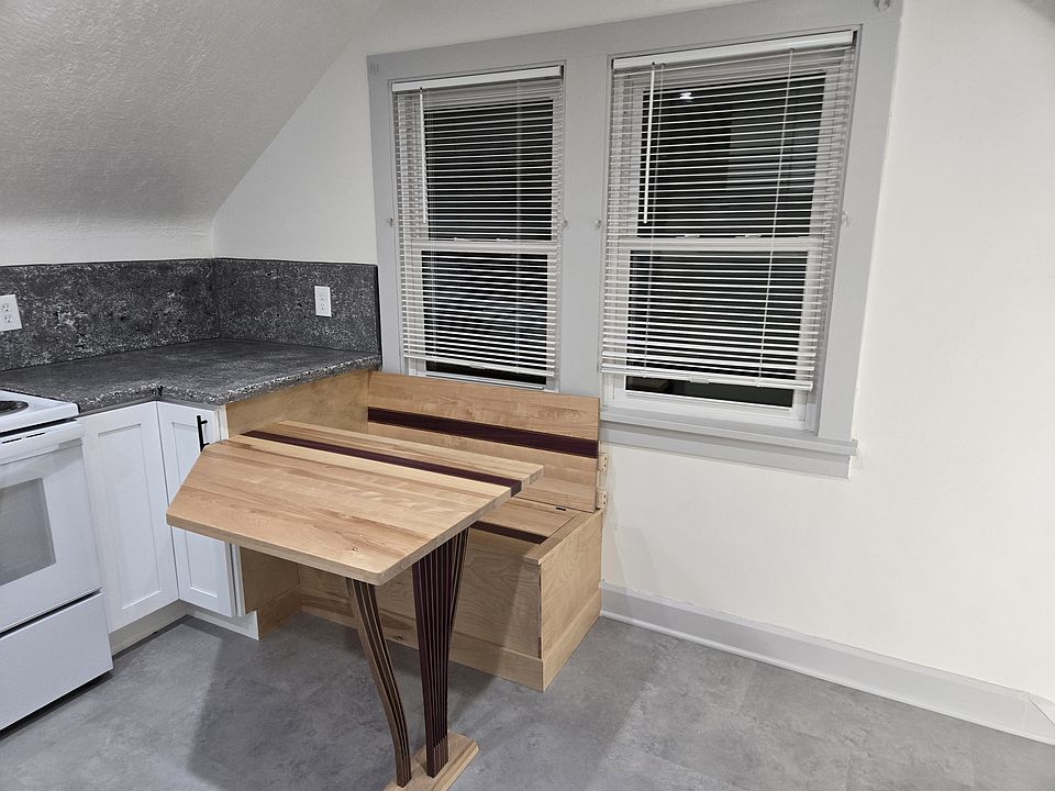 Built in kitchenette table and bench. (Storage in bench)