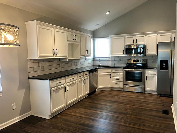 Renovated kitchen. Quartz counters. Stainless steel appliances. Tiled back splash.