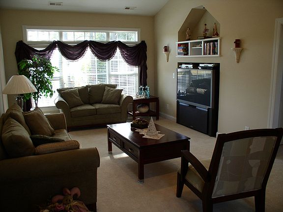 Large windows, vaulted ceilings and recess lighting. Build in for TV.