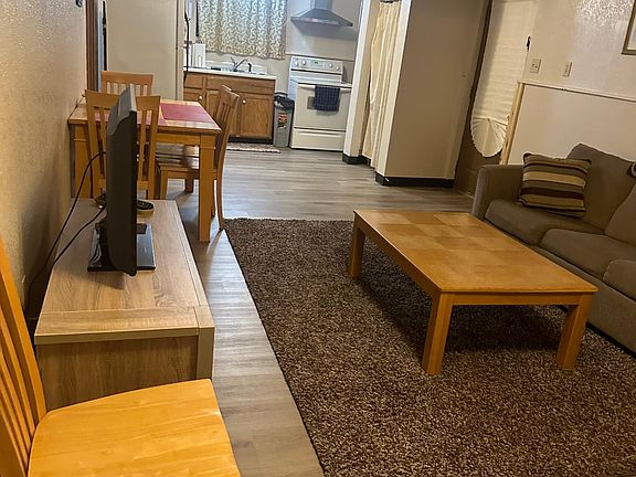 Living room, dining room table, view of kitchen