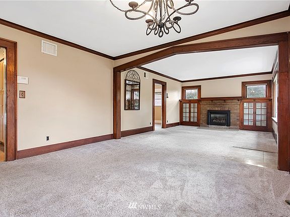 Newer carpet covers the original pine floors.
