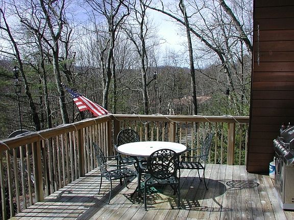 Large deck w/ table and BBQ
