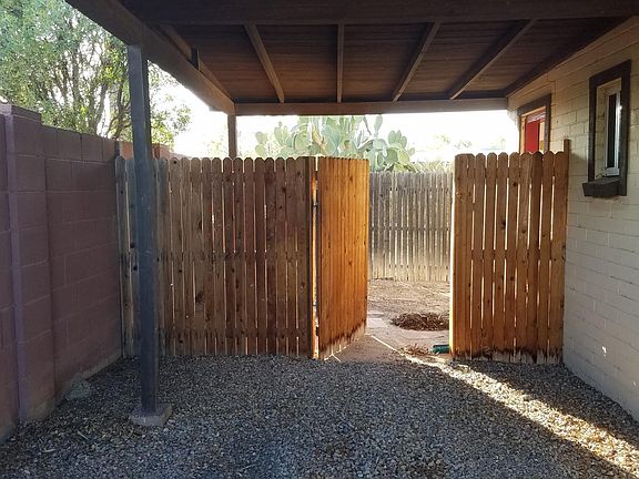 Attached carport, accessed by kitchen door. Gate to backyard