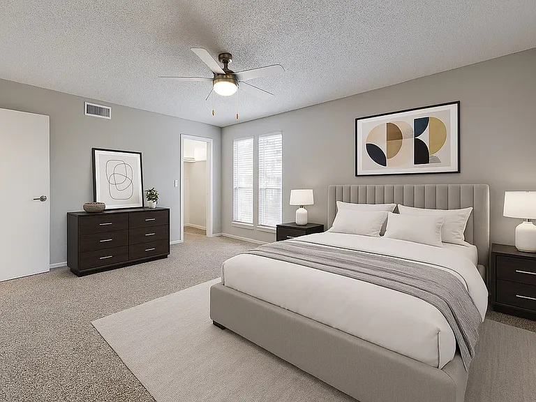 Cozy bedroom featuring a walk in closet Cozy bedroom featuring a walk in closet