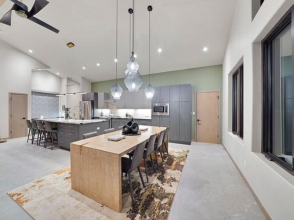 kitchen and dining so close for mealtime ease plus extra seating at the island