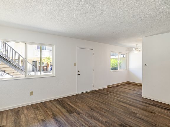 Bright and open one-bedroom unit featuring wood-style flooring and a flexible layout.