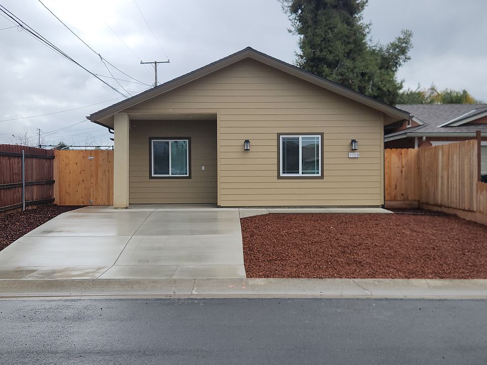 Front view with low maintenance landscaping.