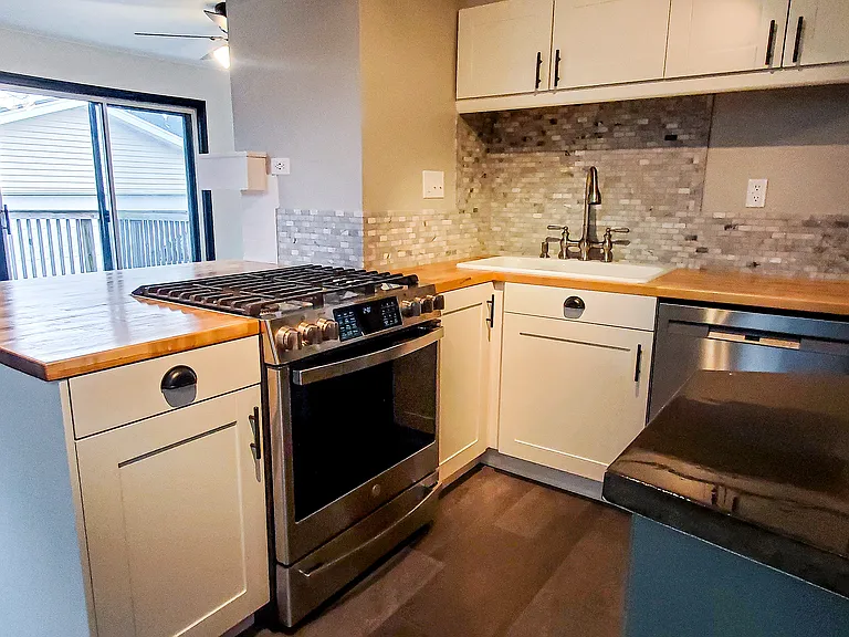 Fully updated kitchen looking into Den