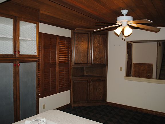 Eating area off of kitchen with built-in cabinetry