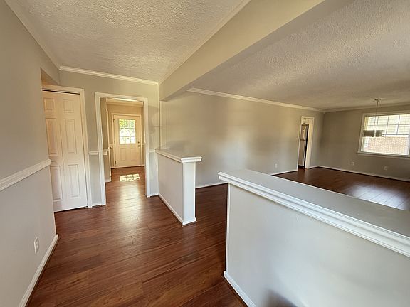 Bright and spacious entrance with large living room on the right