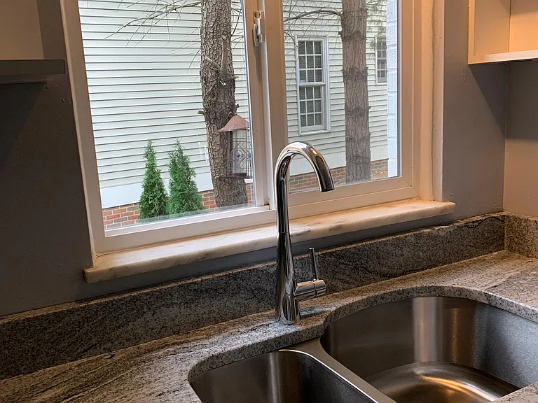 New double sink, faucet and granite countertops