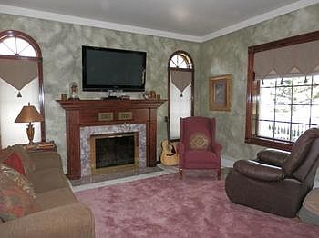 Pleasant living room with woodburning fireplace