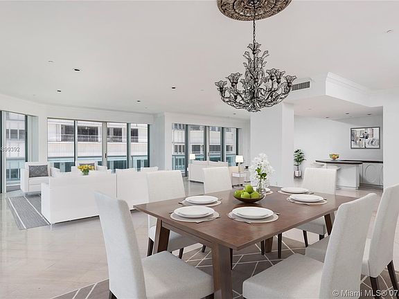 Dining, formal living and family rooms with built-in bar are ideal for hosting and entertaining.