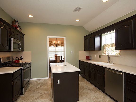 Kitchen conveniently flows into Formal Dining Room.