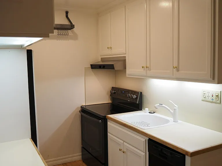 Fully-equipped modern kitchen. New refrigerator and range. Garbage disposal and dishwasher. Range hood vents to outside. Plentiful hot water and pressure.