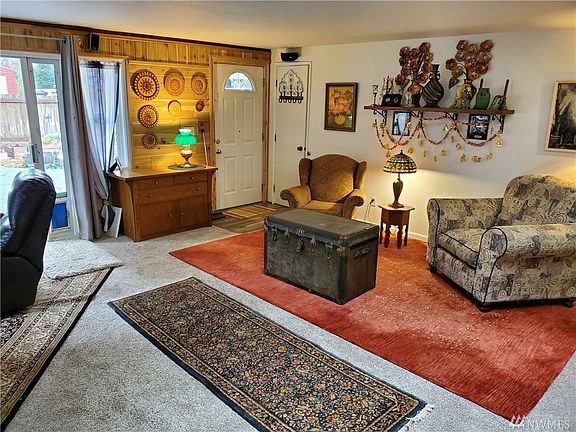 The living room is large and will easily accommodate several chairs, couches or entertainment areas.