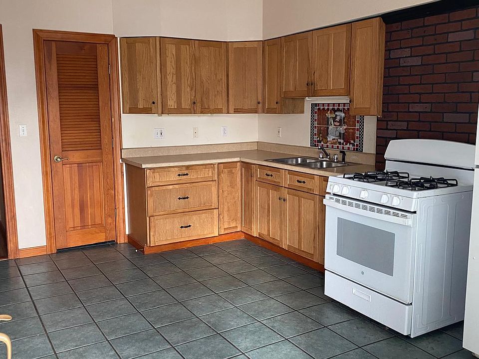 Kitchen with Gas Stove, Refrigerator
