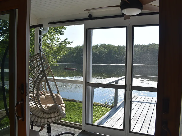 Doors open from the dining room to the inside of the screen porch