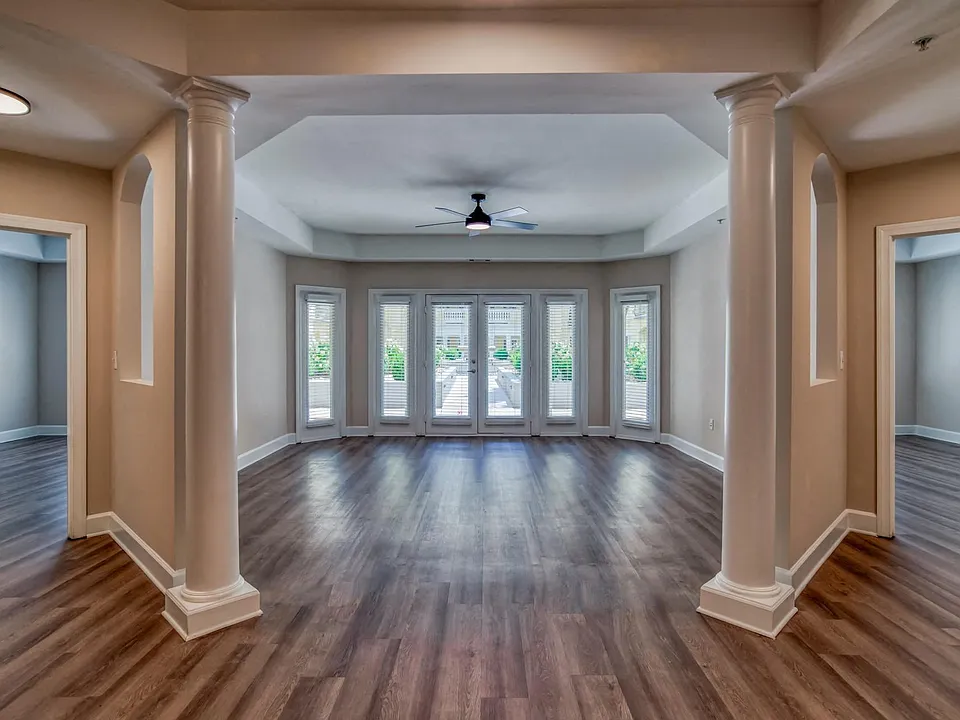 Unique living room layout with large windows that offer an abundance of light