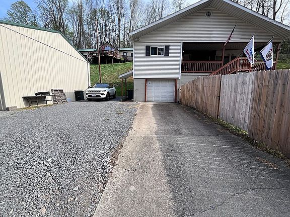 Paved and gravel driveway. 