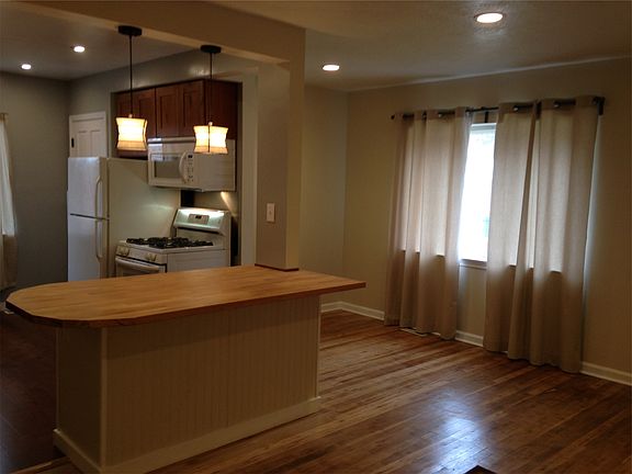 Kitchen opens into large family / dining area. Newly refinis
