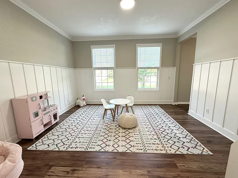 Main floor office / kids play area with pocket doors