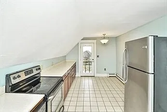 Back of kitchen and door to deck