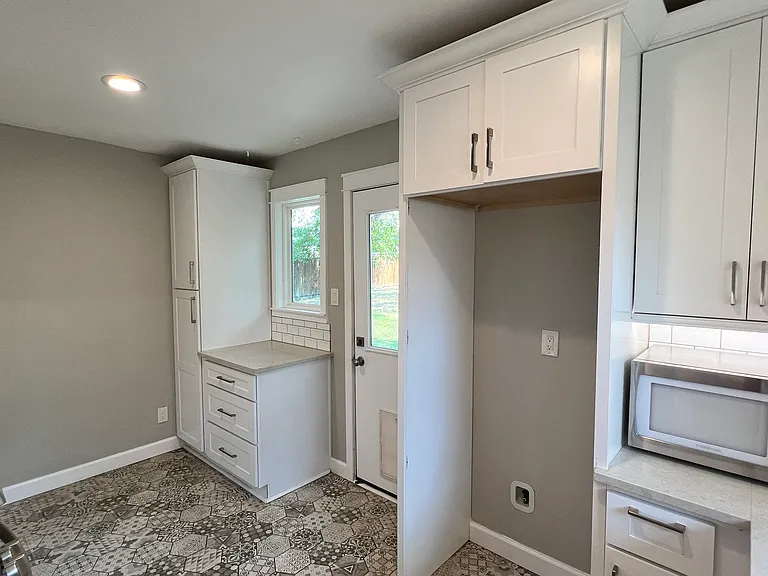 Kitchen
Features: Pantry cabinet, fridge enclosure for 30"W fridge only, microwave.