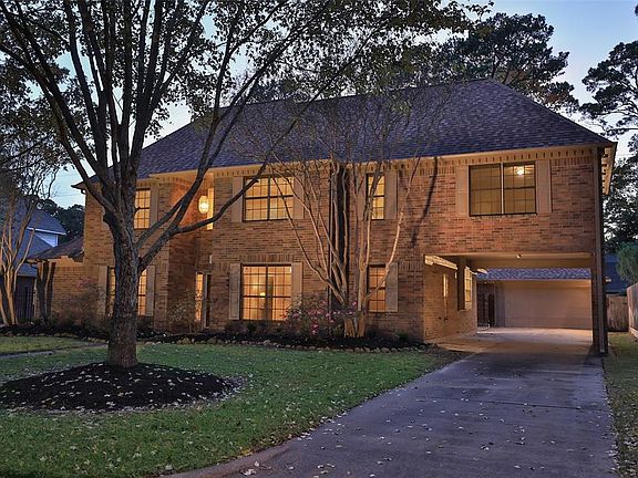 OVER-SIZED TWO-CAR GARAGE - Loads of parking under is available at this home with the car port and over sized garage.