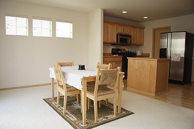 Oversized dining area has a door to the backyard for easy entertaining