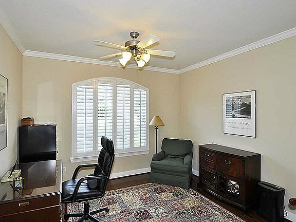 Study boasts wood floors & plenty of widows appointed with Plantation shutters making room extra bright. The view of front yard & quiet cul-de-sac neighborhood island with bench enables time spent here enjoyable!