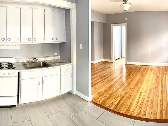 Newly installed countertop and floor tile in the kitchen (stove and fridge included)