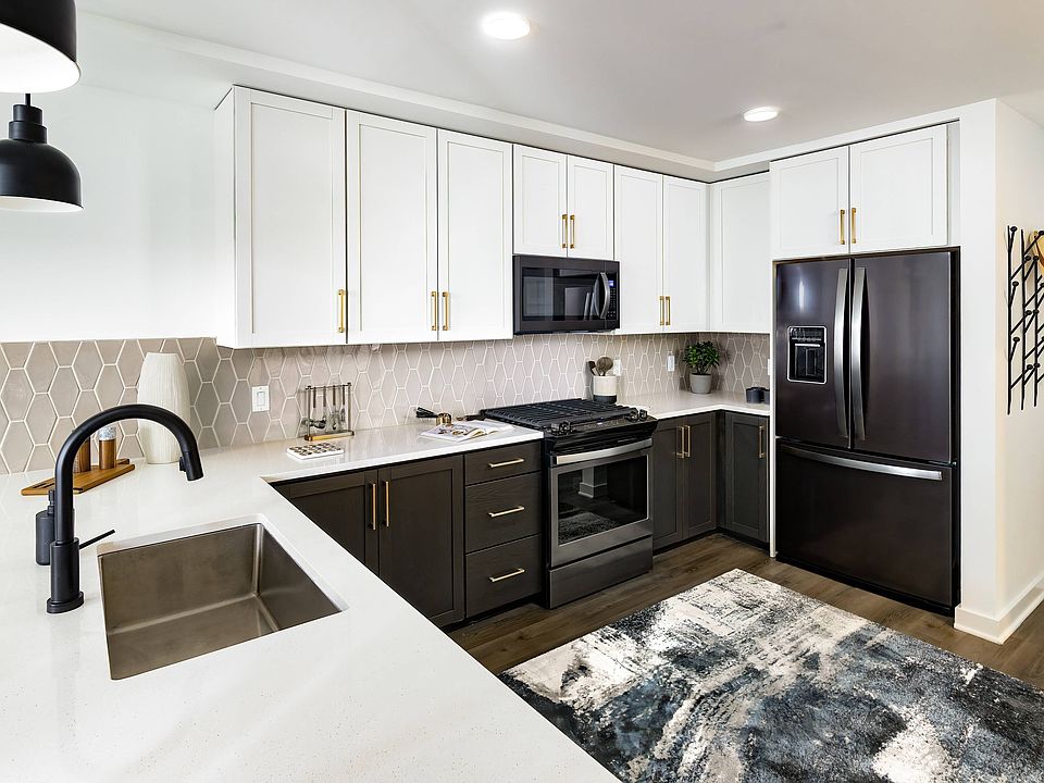 Kitchen with Gas Range Stovetops and Stainless Steel Appliances