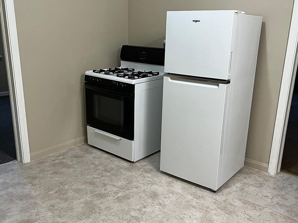 Kitchen with stove and refrigerator