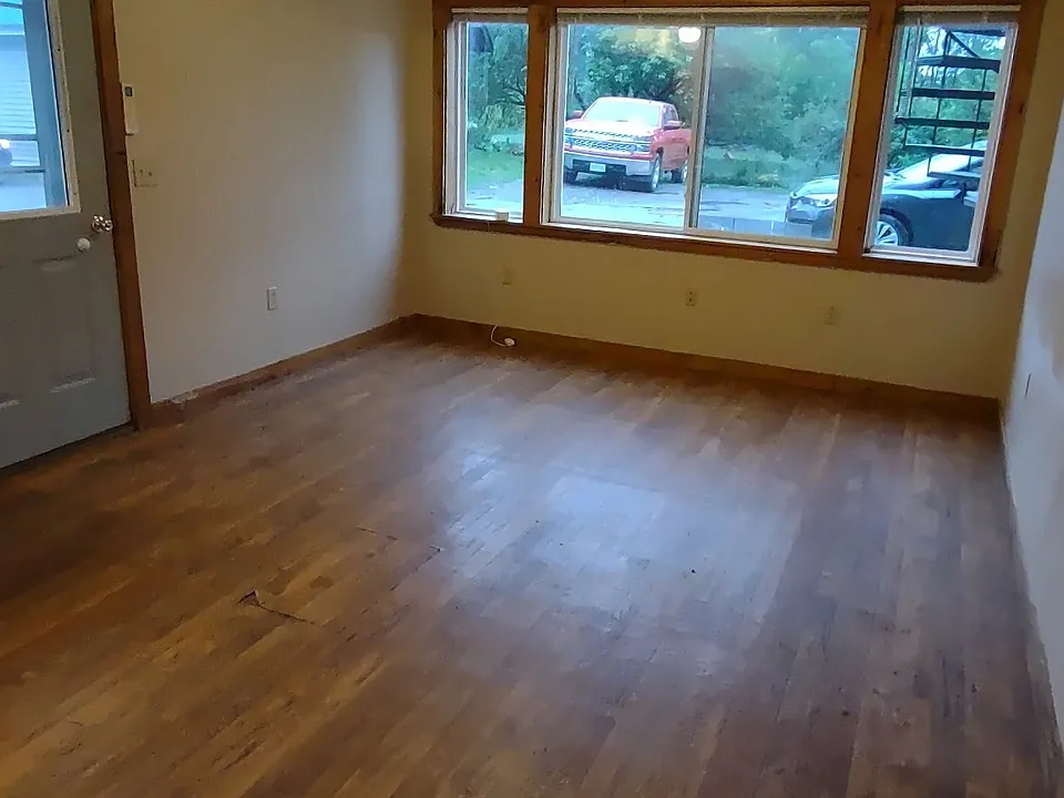 View towards front door and living room from dining area