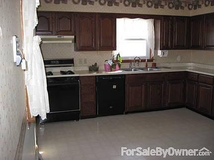 kitchen
						:
						from back door looking in - frig sits to the right next to living room entrance